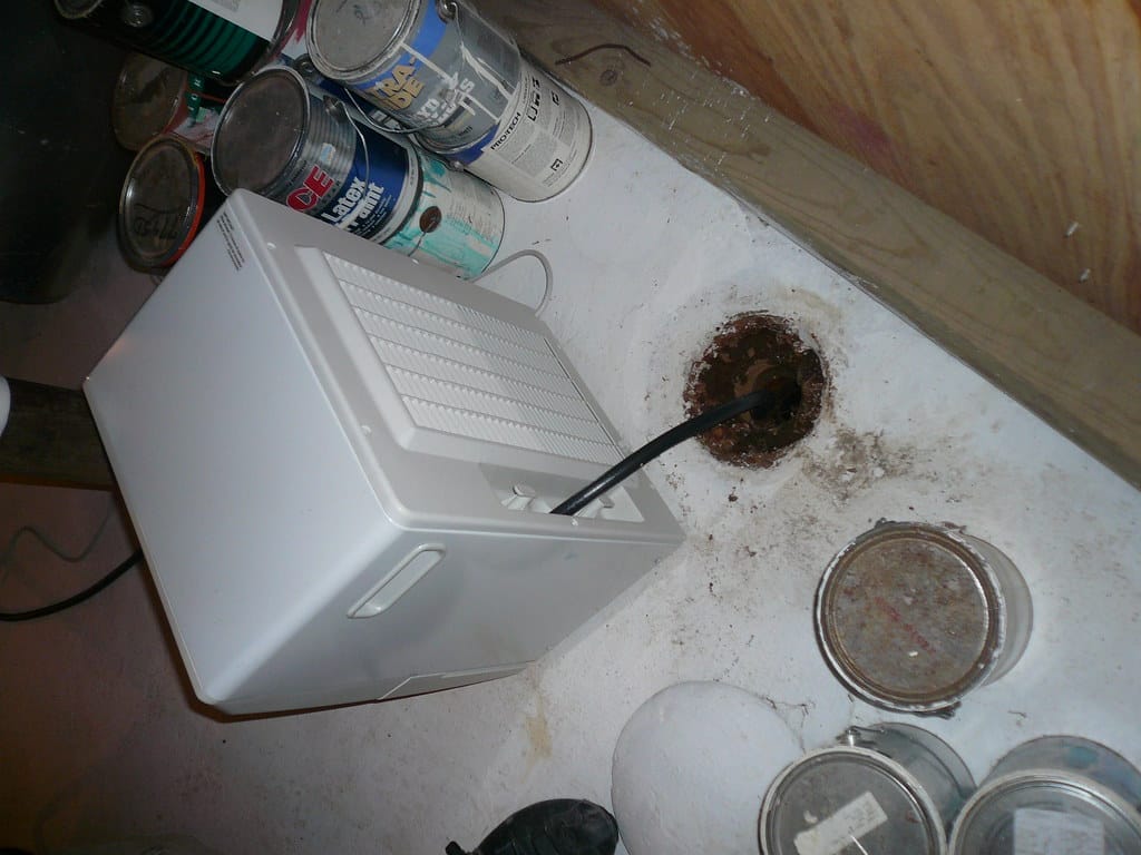 A dehumidifier installed to control humidity in a crawl space